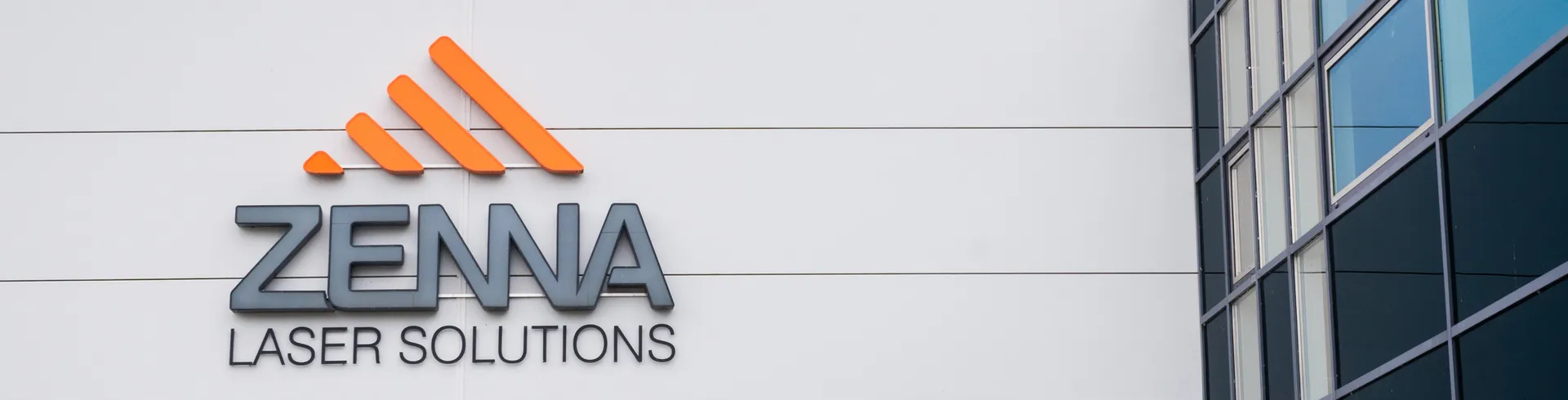 Zenna Laser company logo on office building