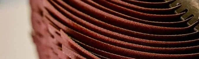 On-the-fly laser cutting of abrasive sheets for deburring brushes and flap wheels
